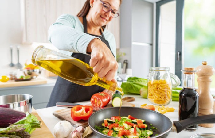 Olive oil contains healthy fats that lower blood cholesterol.